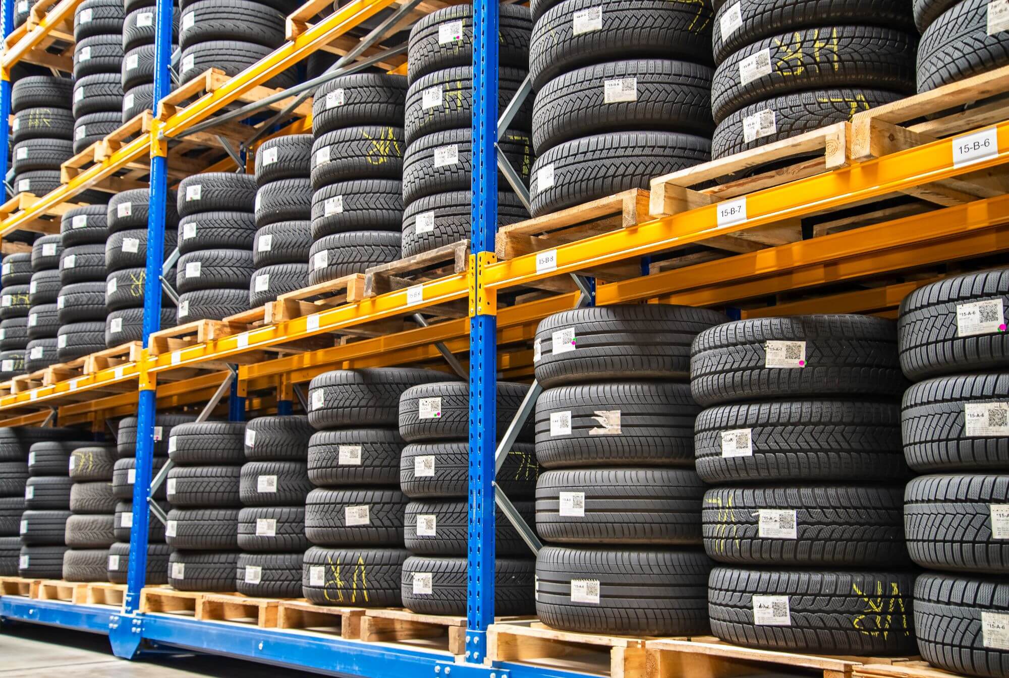 Stacks of new tires in a warehouse