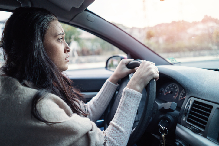 Car jerking stressed woman driver